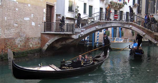 Tourists on gondola in Venice